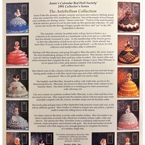 May include: A collection of 12 crochet dolls dressed in various antebellum-era gowns. Each doll is depicted in a different month of the year, starting with January in a blue dress and ending with December in a maroon, white, and green dress. The dolls are part of a series called "Annie's Calendar Bed Doll Society 1991 Collector's Series".