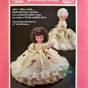 May include: Crochet pattern for a 10 1/2 inch pillow doll and a 13 inch bed doll dress. The pattern features a Cinderella theme and includes instructions for creating a crocheted pillow base for the doll's skirt.