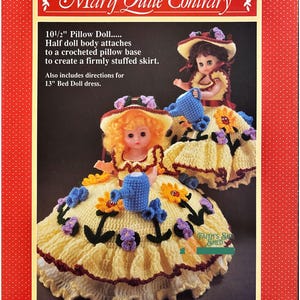 May include: Crochet pattern for a 10 1/2 inch pillow doll with a yellow dress and a blue watering can. The pattern also includes directions for a 13 inch bed doll dress. The pattern is called "Mary Quite Contrary".