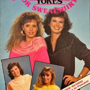 May include: A vintage book cover titled "Knitted Yokes for Sweatshirts" featuring two women and inset photos of knitted yoke designs. The cover has a blue background with pink text and the author's name, Miriam Dow.