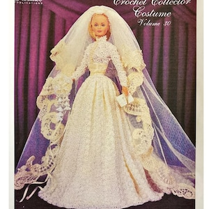 May include: A vintage crochet pattern cover featuring a doll in a cream-colored wedding gown with a long veil. The text reads "Crochet Collector Costume Volume 30" and "1956 Grace Kelly's Wedding Gown". The doll is holding a small bouquet.