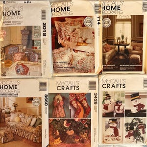 May include: A set of three ceramic mugs with a speckled, matte finish. The mugs are in shades of cream, light gray, and dark gray. Each mug has a simple, minimalist design, perfect for coffee or tea.