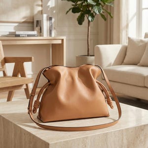 Premium leather cloud bag with magnetic buckle closure. Soft, minimalist design in elegant horizontal square shape. Perfect luxury shoulder bag for work or special occasions. Versatile crossbody messenger. Thoughtful gift for her.