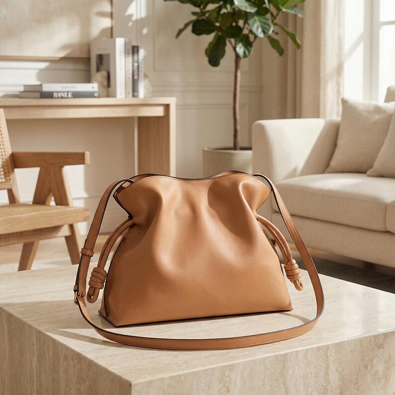 Premium leather cloud bag with magnetic buckle closure. Soft, minimalist design in elegant horizontal square shape. Perfect luxury shoulder bag for work or special occasions. Versatile crossbody messenger. Thoughtful gift for her.
