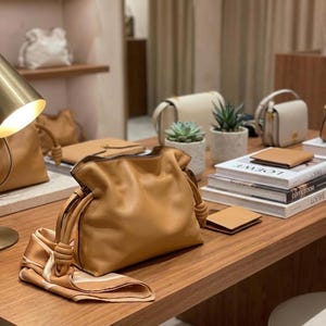 Premium leather cloud bag with magnetic buckle closure. Soft, minimalist design in elegant horizontal square shape. Perfect luxury shoulder bag for work or special occasions. Versatile crossbody messenger. Thoughtful gift for her.