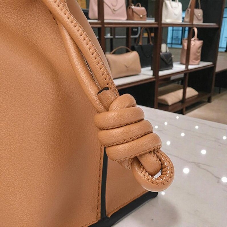 Premium leather cloud bag with magnetic buckle closure. Soft, minimalist design in elegant horizontal square shape. Perfect luxury shoulder bag for work or special occasions. Versatile crossbody messenger. Thoughtful gift for her.