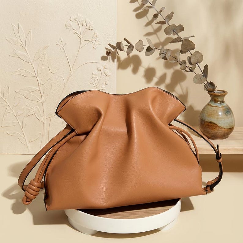 Premium leather cloud bag with magnetic buckle closure. Soft, minimalist design in elegant horizontal square shape. Perfect luxury shoulder bag for work or special occasions. Versatile crossbody messenger. Thoughtful gift for her.