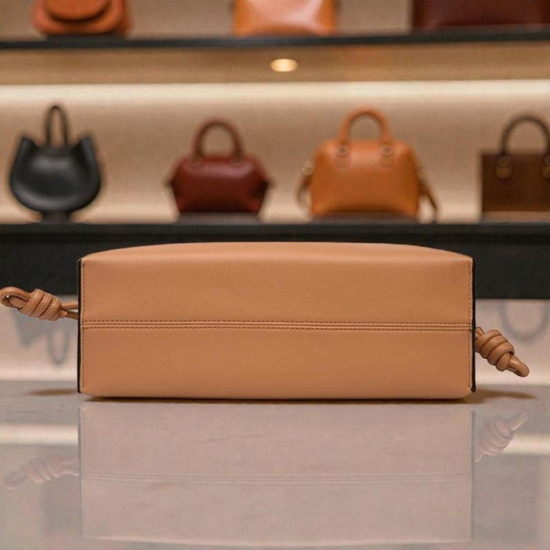Premium leather cloud bag with magnetic buckle closure. Soft, minimalist design in elegant horizontal square shape. Perfect luxury shoulder bag for work or special occasions. Versatile crossbody messenger. Thoughtful gift for her.