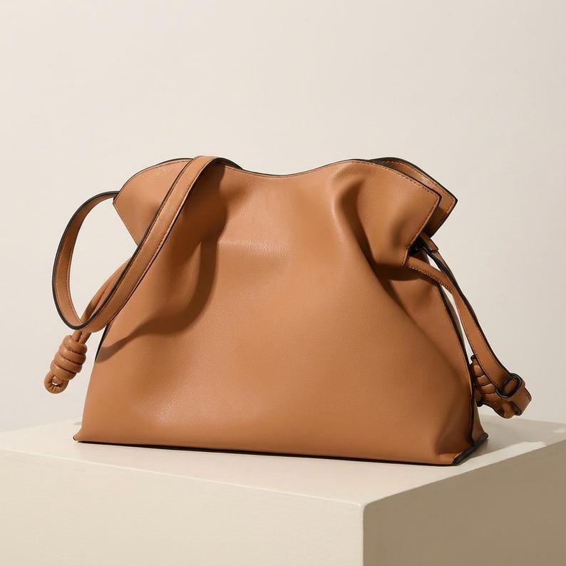 Premium leather cloud bag with magnetic buckle closure. Soft, minimalist design in elegant horizontal square shape. Perfect luxury shoulder bag for work or special occasions. Versatile crossbody messenger. Thoughtful gift for her.