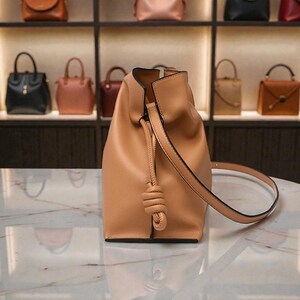 Premium leather cloud bag with magnetic buckle closure. Soft, minimalist design in elegant horizontal square shape. Perfect luxury shoulder bag for work or special occasions. Versatile crossbody messenger. Thoughtful gift for her.