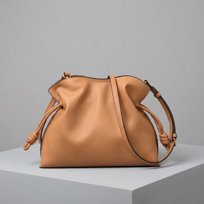 Premium leather cloud bag with magnetic buckle closure. Soft, minimalist design in elegant horizontal square shape. Perfect luxury shoulder bag for work or special occasions. Versatile crossbody messenger. Thoughtful gift for her.