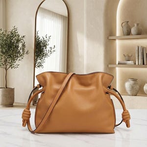 Premium leather cloud bag with magnetic buckle closure. Soft, minimalist design in elegant horizontal square shape. Perfect luxury shoulder bag for work or special occasions. Versatile crossbody messenger. Thoughtful gift for her.