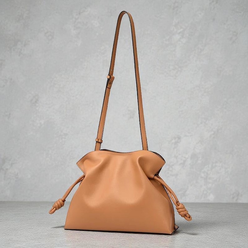 Premium leather cloud bag with magnetic buckle closure. Soft, minimalist design in elegant horizontal square shape. Perfect luxury shoulder bag for work or special occasions. Versatile crossbody messenger. Thoughtful gift for her.