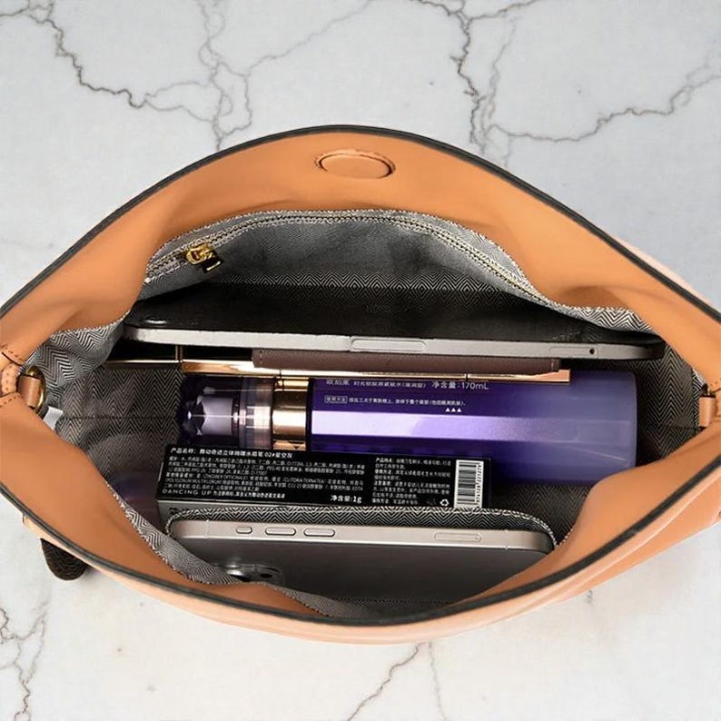 Premium leather cloud bag with magnetic buckle closure. Soft, minimalist design in elegant horizontal square shape. Perfect luxury shoulder bag for work or special occasions. Versatile crossbody messenger. Thoughtful gift for her.