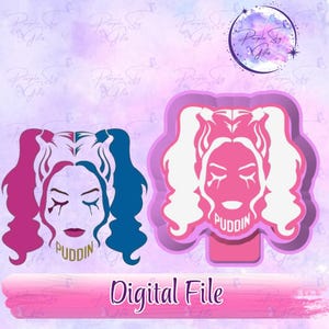 May include: Two digital file designs featuring a stylized female face with pigtails, one in pink and blue, the other in pink. The word "Puddin" is below the face in gold. The text "Digital File" is at the bottom.