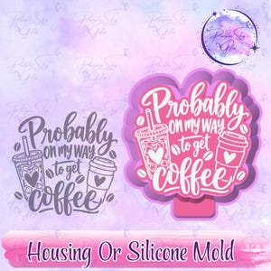 May include: A silicone mold and a corresponding graphic design featuring the text Probably on my way to get coffee, accompanied by illustrations of an iced coffee cup and a hot coffee cup with heart accents, surrounded by scattered coffee beans.