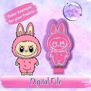 May include: A pink cartoon bunny character with a toothy grin and large eyes, next to a matching cookie cutter. Text reads "Color Example for your freshie" and "Digital File". The background is a soft purple.