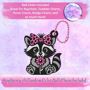 May include: A black and white raccoon charm with a pink bow and flower, attached to a pink ball chain. The charm is designed for keychains, purse charms, and more. Text on the image reads "Ball Chain Included" and "Keychain with Random Color Ball Chain Included."