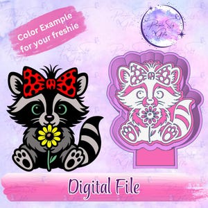 May include: A digital file featuring a cartoon raccoon with a red bow and a yellow flower. The raccoon is black, gray, and white. The image also includes a pink raccoon-shaped mold and the text "Color Example for your freshie" and "Digital File."