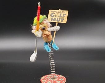 vintage 1979 "World's Best Golf Nut" peanut spring figurine made by The Incredible Nut Inc.