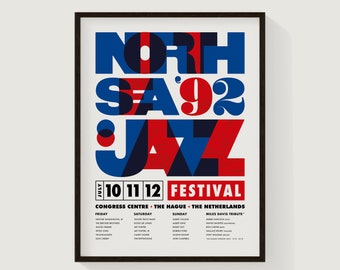 May include: A poster for the North Sea Jazz Festival in The Hague, Netherlands. The poster features a bold, graphic design with the words "North Sea Jazz" in red, blue, and white. The festival dates are July 10-12.