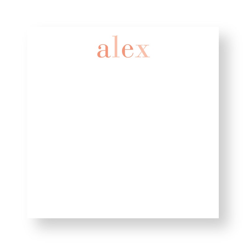 K&ouml;nnte beinhalten: Ein wei&szlig;er Notizblock mit dem Namen "alex" in einem pfirsichfarbenen Orange obenauf gedruckt.