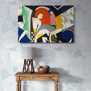 May include: Abstract art print featuring a colorful geometric design with a woman's figure in the center. The print is framed and hanging on a wall with a floral pattern.
