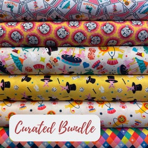 May include: A stack of colorful fabric rolls with circus-themed patterns. Designs include circus tickets, tigers, rabbits, top hats, and geometric shapes. The text "Curated Bundle" is displayed on a white background.