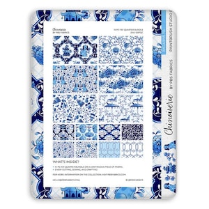 May include: A 14-piece fat quarter fabric bundle titled Chinoiserie by PBS Fabrics. The collection features various blue and white patterns including pagodas, dogs, floral motifs, and geometric designs printed on a continuous piece of fabric.