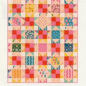 May include: A colorful patchwork quilt titled "Star-Patched Lovers" by Copper Kettle Quilt Company. The throw quilt measures 64.5 x 76.5 inches and features a repeating pattern of squares and star shapes in pink, red, yellow, and blue.