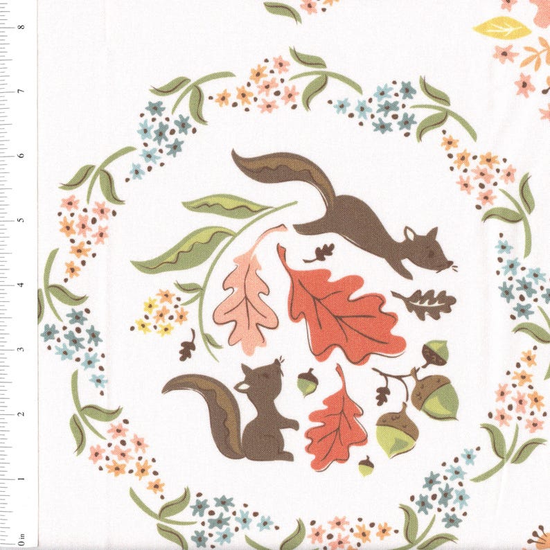 May include: A white fabric with a repeating pattern of squirrels, leaves, and flowers. The squirrels are brown and are jumping through the air. The leaves are red, orange, and green. The flowers are pink, blue, and yellow.