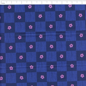May include: A blue and purple fabric with a checkered pattern and small pink flowers. The fabric has a subtle striped texture.