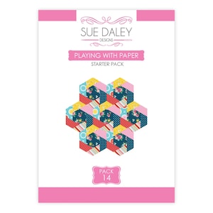May include: A Sue Daley Designs Playing With Paper starter pack, labeled Pack 14. The packaging features a white background with pink borders and a central graphic of seven interconnected hexagons in various floral and geometric patterns.