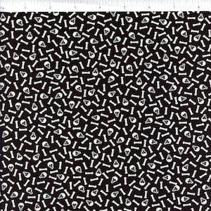 May include: A black fabric with a white repeating pattern of skulls and bones.