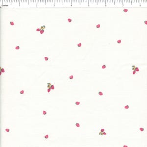 May include: White fabric with a repeating pattern of pink strawberries and green leaves. The strawberries are scattered across the fabric, some clustered together, others isolated. The fabric is measured in inches.