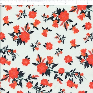 May include: White fabric with a repeating pattern of orange flowers with dark green leaves.