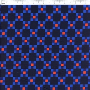May include: A fabric featuring a repeating geometric pattern of dark navy blue squares alternating with smaller bright blue squares, each containing a centered vibrant orange square. A ruler at the top shows a scale of 8 inches.