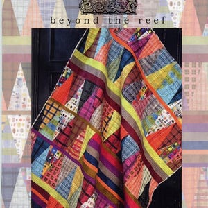 May include: A colorful quilt with a patchwork design, featuring triangles and stripes in various colors like red, blue, yellow, and orange. The quilt has the words "beyond the reef" and "tattoo" in the image.