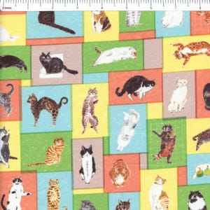 May include: A colorful fabric featuring a repeating pattern of various cat illustrations. The cats are depicted in different poses and colors, set against a backdrop of squares in shades of blue, green, yellow, and orange. The fabric is likely used for crafting or home decor.