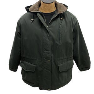 May include: A dark forest green hooded jacket featuring a brown corduroy collar, a full-length front zipper with a snap-button storm flap, two large front flap pockets, and a vertical zippered chest pocket on the left side of the garment.