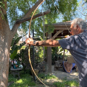 May include: A set of three ceramic mugs with a speckled, matte finish. The mugs are in shades of cream, light gray, and dark gray. Each mug has a simple, minimalist design and a rounded handle.