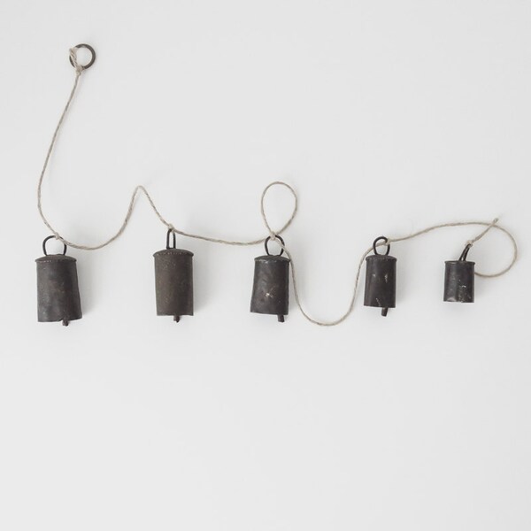 string of antique handmade bells