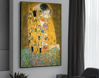 May include: A painting of two figures embracing in a golden, mosaic-like style. The figures are surrounded by a field of colorful flowers. The painting is framed in black.