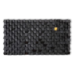 May include: A black and gold geometric wall art piece made of wood. The piece is made up of many small squares that are arranged in a pattern. One square is gold, and the rest are black.