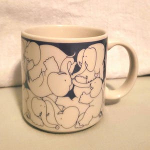Taylor & Ng elephant orgy coffee cup.