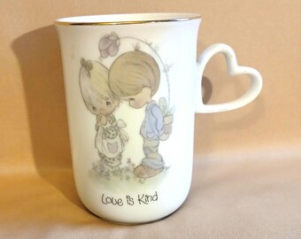 Enesco Precious Moments 1984 Love is Kind mug.