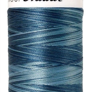 May include: A spool of blue and grey polyester thread with the text "Mettler Group No. 40 800m/875yds" on the label.
