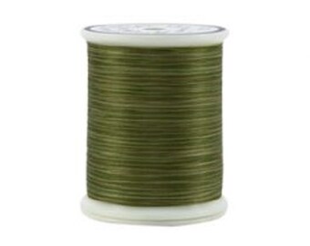 May include: A spool of olive green thread.