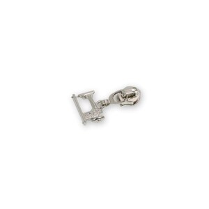May include: Silver zipper pull with a sewing machine charm. The charm is detailed with a small wheel and a needle.