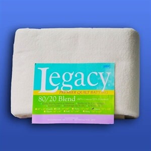 May include: A white 80/20 blend quilt batting from Legacy Premier Quilt Batting. The batting is packaged in a white wrapper with a pink and blue label.